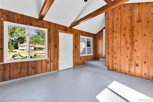 20930 Stahelin Rd, Southfield, MI 48075 - unfurnished living room featuring wooden walls, concrete flooring, and stairway