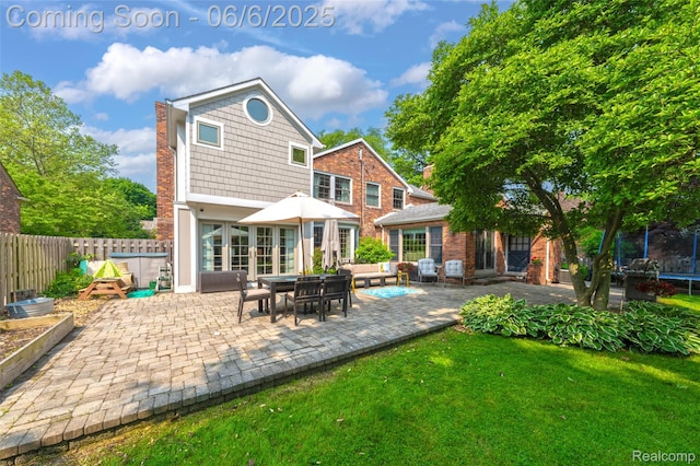 828 Westchester Rd, Grosse Pointe Park, MI 48230 - rear view of house featuring a patio area and a chimney