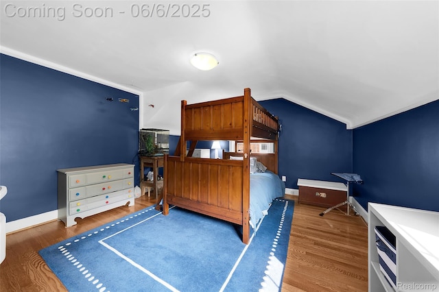 828 Westchester Rd, Grosse Pointe Park, MI 48230 - bedroom with lofted ceiling, wood finished floors, and baseboards