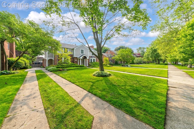 828 Westchester Rd, Grosse Pointe Park, MI 48230 - view of front facade with a front lawn, brick siding, and a residential view