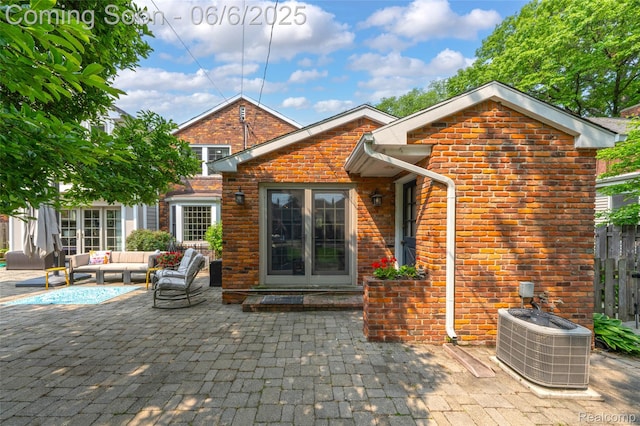 828 Westchester Rd, Grosse Pointe Park, MI 48230 - rear view of house featuring central AC, a patio, an outdoor hangout area, and brick siding