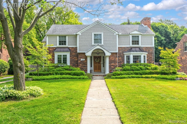 828 Westchester Rd, Grosse Pointe Park, MI 48230 - shingle-style home featuring a front yard, a chimney, and brick siding