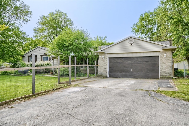 11305 Cook Rd, Gaines, MI 48436 - view of front of home with brick siding, concrete driveway, and an attached garage