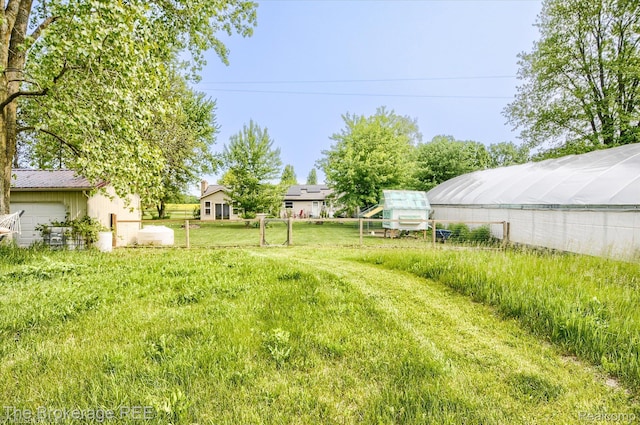11305 Cook Rd, Gaines, MI 48436 - view of grassy yard with an outdoor structure and a greenhouse