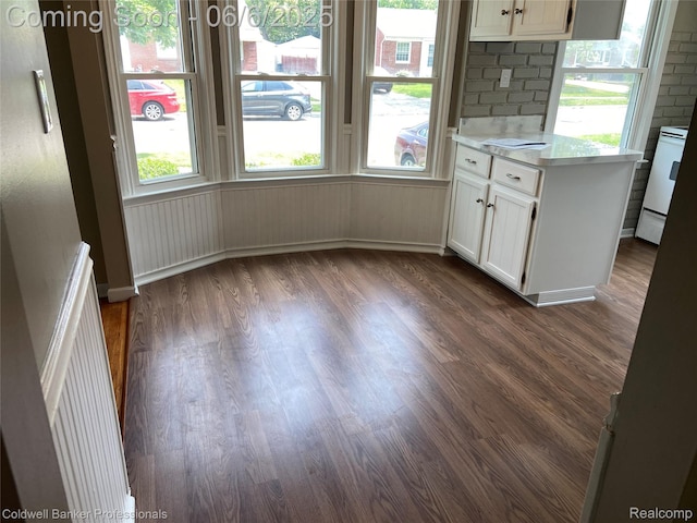 18980 Roscommon St, Grosse Pointe, MI 48225 - unfurnished dining area featuring dark wood finished floors and baseboards