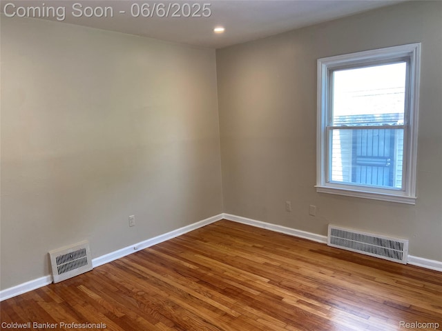 18980 Roscommon St, Grosse Pointe, MI 48225 - empty room with wood finished floors and baseboards