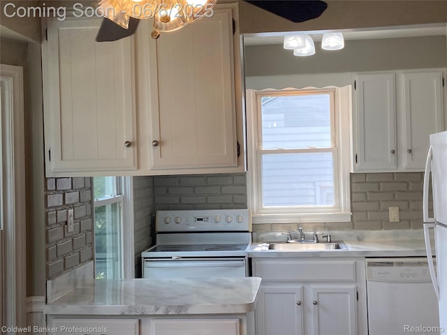 18980 Roscommon St, Grosse Pointe, MI 48225 - kitchen featuring white appliances, a sink, light countertops, and white cabinets