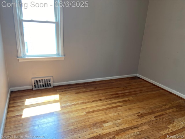 18980 Roscommon St, Grosse Pointe, MI 48225 - empty room featuring wood finished floors and baseboards