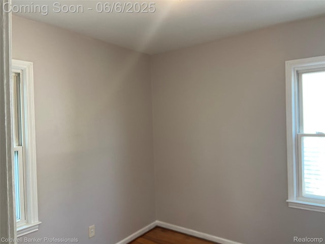 18980 Roscommon St, Grosse Pointe, MI 48225 - spare room with baseboards and dark wood-type flooring