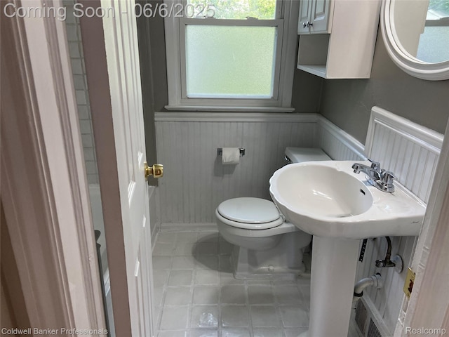 18980 Roscommon St, Grosse Pointe, MI 48225 - half bathroom with toilet and a wainscoted wall