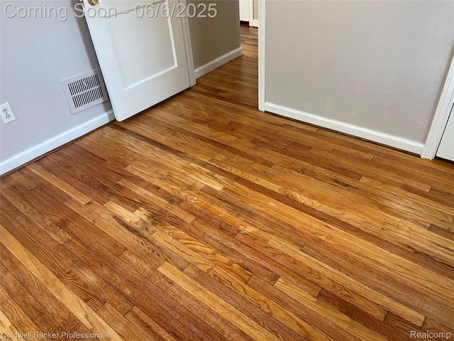 18980 Roscommon St, Grosse Pointe, MI 48225 - unfurnished bedroom featuring hardwood / wood-style flooring and baseboards
