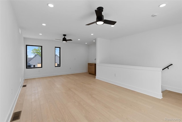 3420 Cochrane St Unit 2, Detroit, MI 48208 - unfurnished living room with ceiling fan, light wood-style flooring, recessed lighting, and baseboards