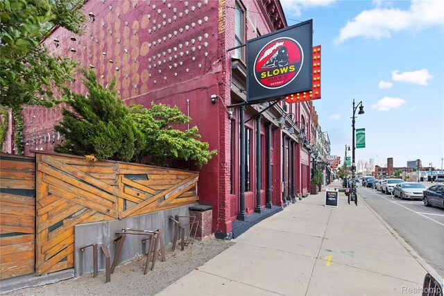 3420 Cochrane St Unit 2, Detroit, MI 48208 - view of asphalt road featuring sidewalks, street lighting, curbs, and traffic lights