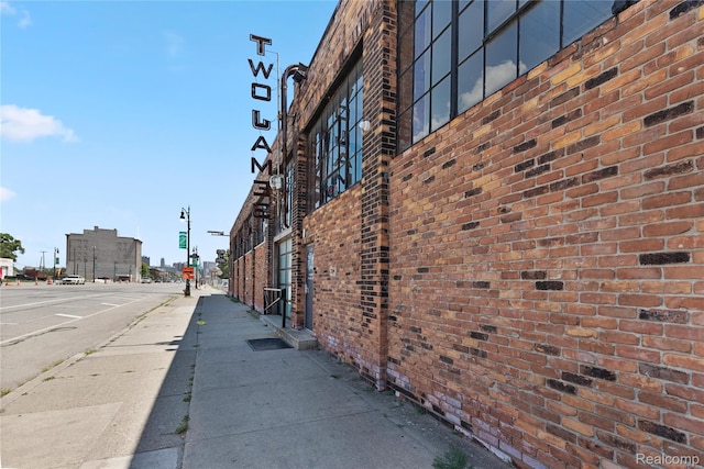 3420 Cochrane St Unit 2, Detroit, MI 48208 - view of street featuring sidewalks, street lighting, curbs, and traffic signs