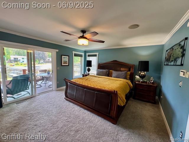 1158 Camelot Dr, Pinckney, MI 48169 - carpeted bedroom featuring access to outside, ornamental molding, baseboards, and a ceiling fan