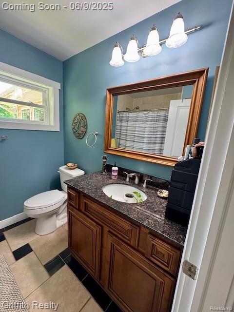 1158 Camelot Dr, Pinckney, MI 48169 - full bath with vanity, toilet, a shower with curtain, and tile patterned flooring