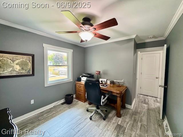 1158 Camelot Dr, Pinckney, MI 48169 - home office with light wood-type flooring, a ceiling fan, crown molding, and baseboards