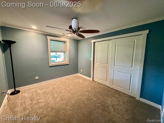 1158 Camelot Dr, Pinckney, MI 48169 - unfurnished bedroom with ornamental molding, carpet, baseboards, a closet, and ceiling fan