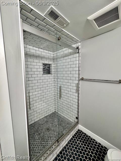 1158 Camelot Dr, Pinckney, MI 48169 - full bath with a shower stall, toilet, and baseboards