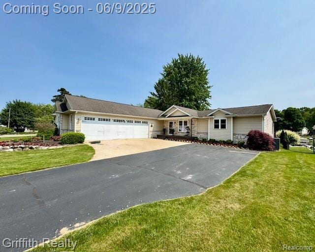1158 Camelot Dr, Pinckney, MI 48169 - single story home featuring an attached garage, concrete driveway, and a front lawn