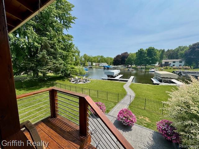 1158 Camelot Dr, Pinckney, MI 48169 - wooden terrace with a water view and a boat dock