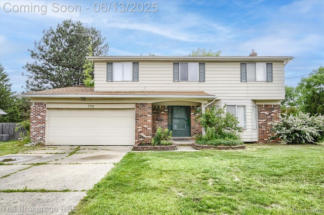 732 E Grand Blanc Rd, Grand Blanc, MI 48439 - view of front of home with brick siding, concrete driveway, and central air condition unit