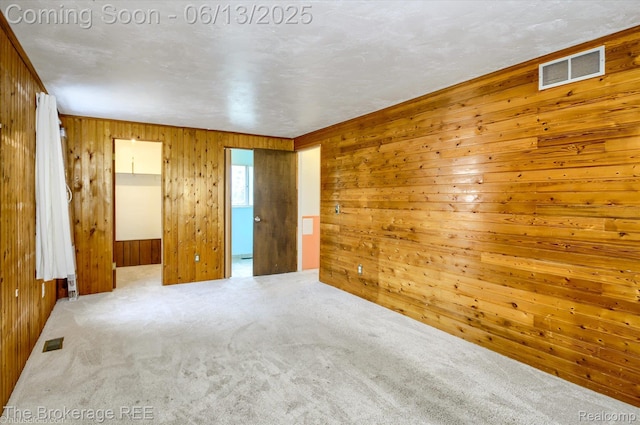 732 E Grand Blanc Rd, Grand Blanc, MI 48439 - carpeted spare room with wood walls