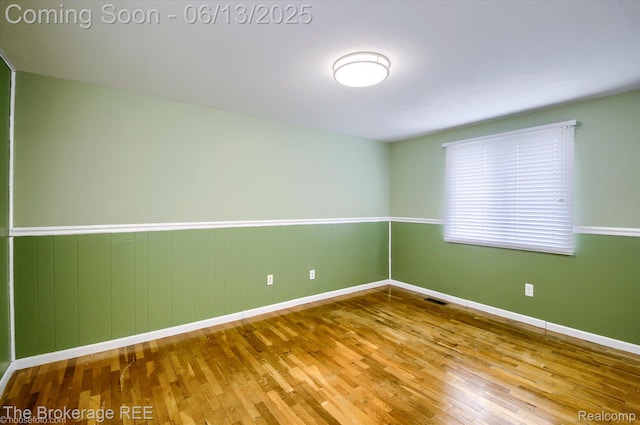 732 E Grand Blanc Rd, Grand Blanc, MI 48439 - empty room with wood finished floors and baseboards