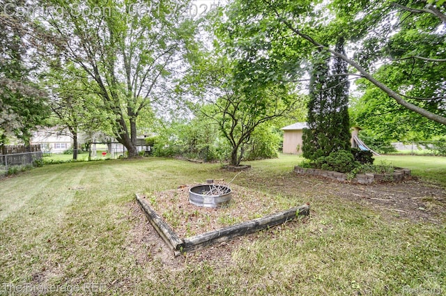 732 E Grand Blanc Rd, Grand Blanc, MI 48439 - view of yard featuring a fire pit