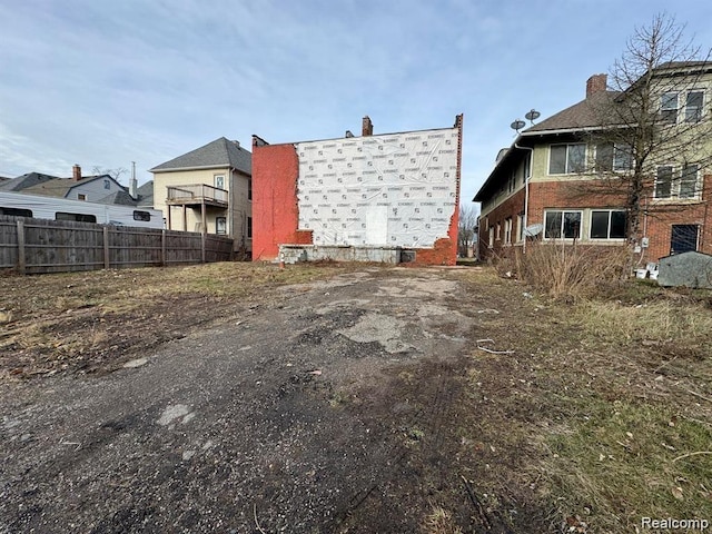 691 Clairmount St, Detroit, MI 48202 - back of property with brick siding and a chimney