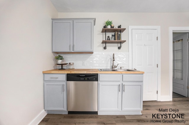 109 Leonard St NE, Grand Rapids, MI 49503 - kitchen with dishwasher, butcher block counters, a sink, and open shelves