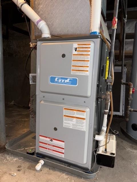 109 Leonard St NE, Grand Rapids, MI 49503 - utility room featuring heating unit