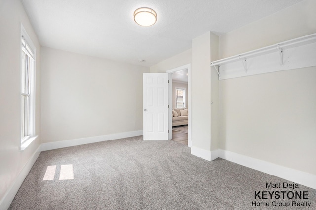 109 Leonard St NE, Grand Rapids, MI 49503 - unfurnished bedroom featuring carpet floors and baseboards