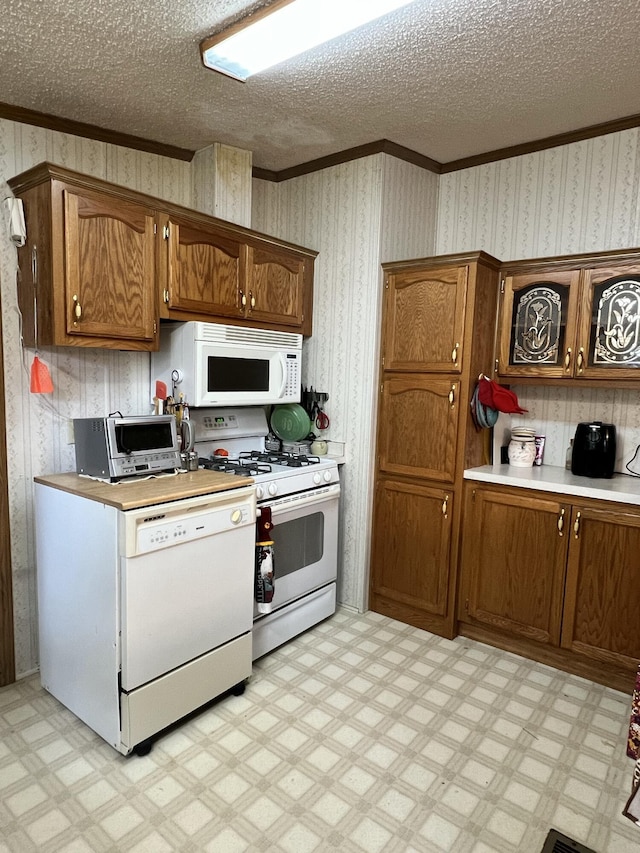 4153 Whisperwood Way S, Muskegon, MI 49442 - kitchen with white appliances, ornamental molding, light flooring, light countertops, and brown cabinets