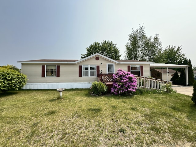 4153 Whisperwood Way S, Muskegon, MI 49442 - manufactured / mobile home with an attached carport and a front lawn