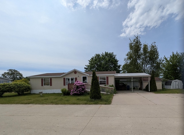 4153 Whisperwood Way S, Muskegon, MI 49442 - manufactured / mobile home with driveway, a carport, and a front lawn