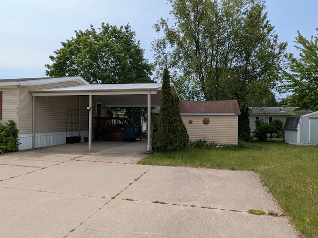 4153 Whisperwood Way S, Muskegon, MI 49442 - view of car parking featuring a storage shed, driveway, and a carport