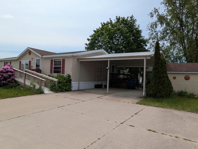 4153 Whisperwood Way S, Muskegon, MI 49442 - manufactured / mobile home with concrete driveway and an attached carport