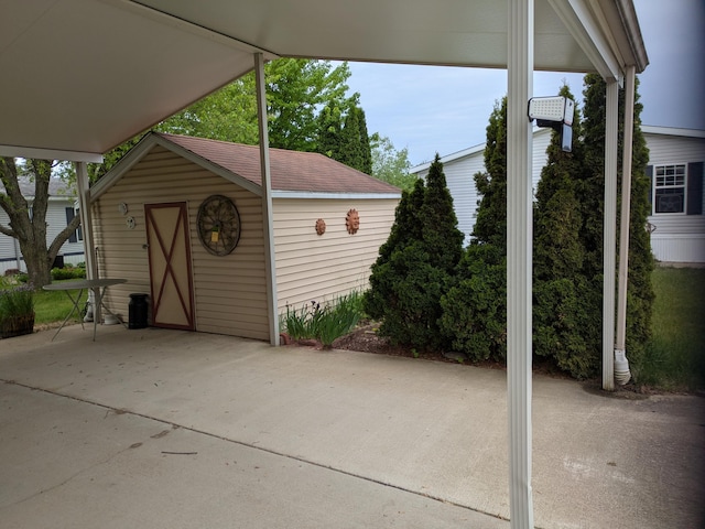 4153 Whisperwood Way S, Muskegon, MI 49442 - view of patio / terrace featuring an outbuilding