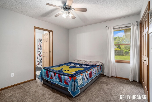 7460 Anthony St, Whitehall, MI 49461 - bedroom featuring a textured ceiling, carpet floors, baseboards, and ceiling fan