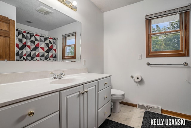 7460 Anthony St, Whitehall, MI 49461 - full bath featuring toilet, vanity, healthy amount of natural light, and baseboards