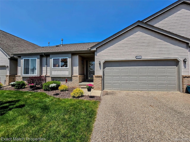 45009 Mitchell St, Grand Blanc, MI 48439 - view of front facade with brick siding, a garage, asphalt driveway, a front lawn, and a shingled roof