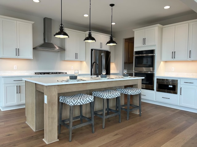 4846 W Burton Ln Unit 22, Saline, MI 48176 - kitchen featuring wall chimney exhaust hood, freestanding refrigerator, dark wood-type flooring, light countertops, and double oven