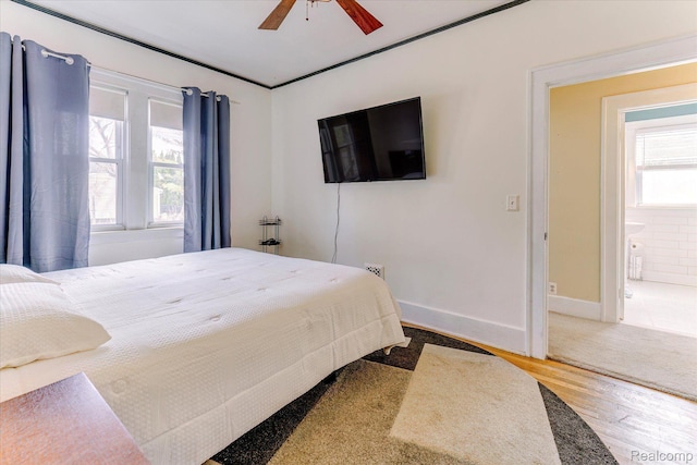 2210 Cambridge Rd, Berkley, MI 48072 - bedroom featuring wood finished floors, baseboards, a ceiling fan, and ensuite bathroom