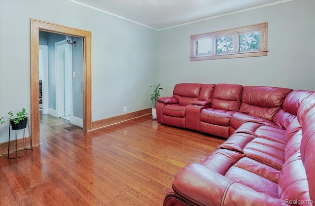 2210 Cambridge Rd, Berkley, MI 48072 - living room featuring light wood-style flooring, crown molding, and baseboards