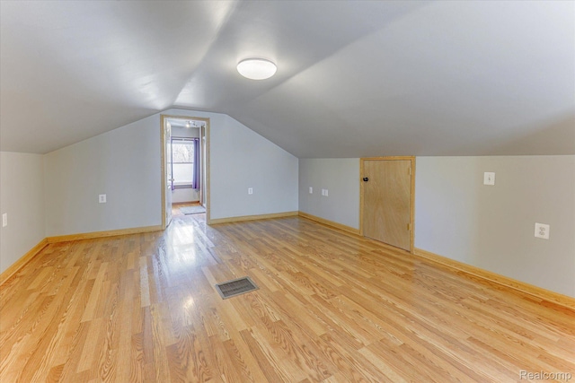 2210 Cambridge Rd, Berkley, MI 48072 - additional living space with light wood-style flooring, lofted ceiling, and baseboards