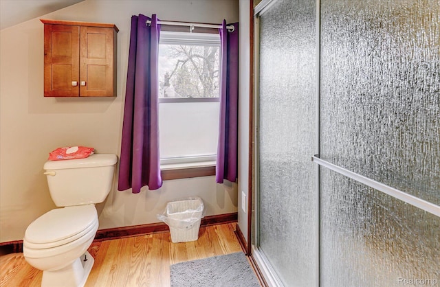 2210 Cambridge Rd, Berkley, MI 48072 - bathroom featuring wood finished floors, toilet, a stall shower, and baseboards