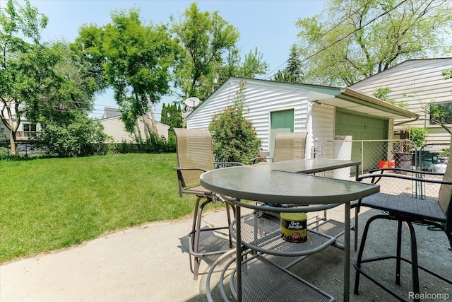 2210 Cambridge Rd, Berkley, MI 48072 - view of patio / terrace featuring outdoor dining space and a garage