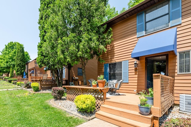 5576 N Watervliet Rd Unit 11, Watervliet, MI 49098 - wooden deck featuring central AC and a yard