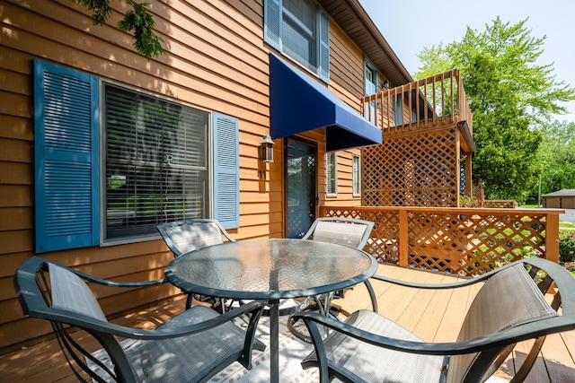 5576 N Watervliet Rd Unit 11, Watervliet, MI 49098 - wooden terrace featuring outdoor dining space